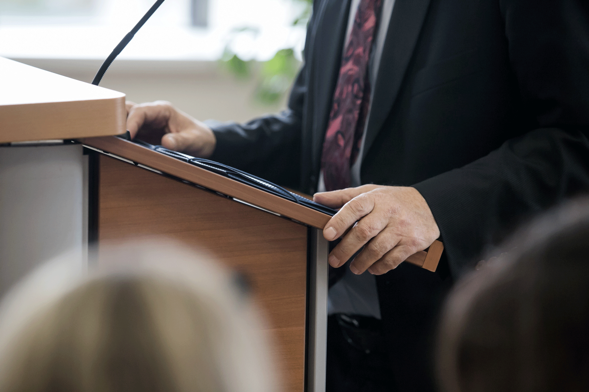 Lawyer in courtroom standing at the podium.